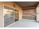 Covered patio featuring a sliding glass door and decorative elements at 44560 W Copper Trl, Maricopa, AZ 85139