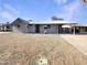 Charming single-story home with a well-maintained gravel yard and covered front entrance, showcasing classic curb appeal at 470 S Daley --, Mesa, AZ 85204