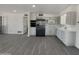 Modern kitchen with stainless steel appliances and ample counter space, seamlessly integrated with the open-concept living area at 470 S Daley --, Mesa, AZ 85204