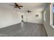 Bright living room with dual ceiling fans, luxury vinyl plank flooring, and natural light at 470 S Daley --, Mesa, AZ 85204