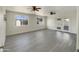 Bright living room with dual ceiling fans, luxury vinyl plank flooring, and natural light at 470 S Daley --, Mesa, AZ 85204
