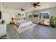 Serene main bedroom boasts ample space, neutral tones, ceiling fans, and picturesque windows, offering a relaxing retreat at 470 S Daley --, Mesa, AZ 85204