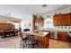 Spacious kitchen showcasing a central island, tile floors and stainless steel dishwasher at 4823 S Oleander Dr, Chandler, AZ 85248