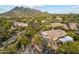Desert home with a private pool and patio nestled in a lush, gated community with mountain views at 6128 E Brilliant Sky Dr, Scottsdale, AZ 85266