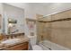 Bathroom with tan granite countertop, tile shower, and modern fixtures at 6128 E Brilliant Sky Dr, Scottsdale, AZ 85266