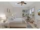 Well-lit bedroom with white decor, plantation shutters, and geometric accents at 6128 E Brilliant Sky Dr, Scottsdale, AZ 85266