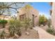 Charming home exterior featuring desert landscaping and a flagstone walkway to the front door at 6128 E Brilliant Sky Dr, Scottsdale, AZ 85266