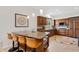 Gourmet kitchen boasts an island with bar seating, granite countertops and custom cabinetry at 6128 E Brilliant Sky Dr, Scottsdale, AZ 85266