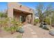 Outdoor patio featuring a desert landscape with seating, and a covered area at 6128 E Brilliant Sky Dr, Scottsdale, AZ 85266