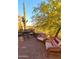 Open patio featuring desert landscaping, wrought iron fence, and comfortable seating and dining areas at 6230 S Mesa Vista Dr, Gold Canyon, AZ 85118