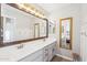 Spacious bathroom with dual sinks, a large mirror, and wood-look floors at 6230 S Mesa Vista Dr, Gold Canyon, AZ 85118