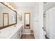 Bathroom featuring dual sinks, framed mirrors, and a shower-tub combo at 6230 S Mesa Vista Dr, Gold Canyon, AZ 85118