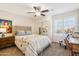 Bright bedroom with a ceiling fan, plantation shutters, and carpet flooring at 6230 S Mesa Vista Dr, Gold Canyon, AZ 85118