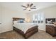 Cozy bedroom with a ceiling fan, natural light, and carpet flooring at 6230 S Mesa Vista Dr, Gold Canyon, AZ 85118