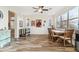 Open dining room featuring wood floors, a wooden table, and a large window providing natural light at 6230 S Mesa Vista Dr, Gold Canyon, AZ 85118
