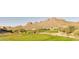 Scenic golf course view with rolling hills and mountain views, offering a serene and active lifestyle at 6230 S Mesa Vista Dr, Gold Canyon, AZ 85118