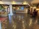 Hotel lobby with comfortable seating area, stone floors, and rustic design elements at 6230 S Mesa Vista Dr, Gold Canyon, AZ 85118