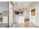 Modern kitchen with stainless steel appliances and sleek countertops, adjacent to a sliding door at 6230 S Mesa Vista Dr, Gold Canyon, AZ 85118