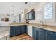 Well-lit kitchen features granite countertops, stainless steel sink, and updated cabinetry at 6230 S Mesa Vista Dr, Gold Canyon, AZ 85118