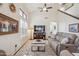 Inviting living room with vaulted ceilings, comfortable seating, and a mounted TV above an entertainment center at 6230 S Mesa Vista Dr, Gold Canyon, AZ 85118