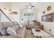 Cozy living room featuring high ceilings, a ceiling fan, and comfortable seating on top of a large area rug at 6230 S Mesa Vista Dr, Gold Canyon, AZ 85118