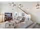 Inviting living room featuring a neutral color palette, plush seating, and a staircase leading to the upper level at 6230 S Mesa Vista Dr, Gold Canyon, AZ 85118