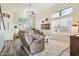 Bright living room with a ceiling fan, high ceilings, and an abundance of natural light at 6230 S Mesa Vista Dr, Gold Canyon, AZ 85118