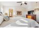 Bright main bedroom with vaulted ceiling, wooden dresser, and ensuite bath entrance at 6230 S Mesa Vista Dr, Gold Canyon, AZ 85118