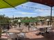 Outdoor patio seating area overlooking golf course with mountain views at 6230 S Mesa Vista Dr, Gold Canyon, AZ 85118