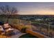 Outdoor patio featuring desert views, comfortable seating, a cozy fire pit, and beautiful sunset vistas at 6230 S Mesa Vista Dr, Gold Canyon, AZ 85118