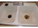 Close-up of a dual basin kitchen sink at 6351 W Mountain View Rd, Glendale, AZ 85302