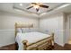 Cozy bedroom with hardwood floors, a tray ceiling, and a stylish brass bed frame at 6803 E Main St # 2210, Scottsdale, AZ 85251