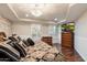 A bedroom with a large bed, decorative ceiling, hardwood floors, and plantation shutters at 6803 E Main St # 2210, Scottsdale, AZ 85251