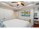 This comfortable bedroom features hardwood floors, a tray ceiling, and an entertainment system at 6803 E Main St # 2210, Scottsdale, AZ 85251