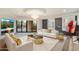 Chic living room featuring stylish white furniture, a glass coffee table, and an entertainment center at 6803 E Main St # 2210, Scottsdale, AZ 85251