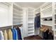 Spacious walk-in closet with custom shelving and hanging racks, providing ample storage for clothes and accessories at 6803 E Main St # 2210, Scottsdale, AZ 85251