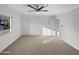Spacious bedroom with neutral carpeting, closet and abundant natural light at 701 W Wilshire Dr, Phoenix, AZ 85007