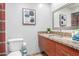 Well-lit bathroom featuring granite counters, and modern fixtures, offering a clean and stylish design at 7720 E Heatherbrae Ave # 13, Scottsdale, AZ 85251