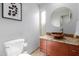 Bathroom with a vessel sink, modern fixtures, and decorative art enhancing the serene atmosphere at 7720 E Heatherbrae Ave # 13, Scottsdale, AZ 85251