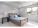 Bright bedroom features a large window, ceiling fan and queen bed at 7720 E Heatherbrae Ave # 13, Scottsdale, AZ 85251