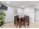 Modern dining area with a glass-top table and stylish chairs at 7720 E Heatherbrae Ave # 13, Scottsdale, AZ 85251