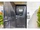 Close-up of the condo's secure front door and cheerful welcome sign at 7720 E Heatherbrae Ave # 13, Scottsdale, AZ 85251