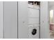 Laundry area equipped with a stacked washer and dryer unit behind closed doors at 7720 E Heatherbrae Ave # 13, Scottsdale, AZ 85251