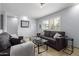 Inviting living room with shutters, tile floors, and stylish furniture at 7720 E Heatherbrae Ave # 13, Scottsdale, AZ 85251