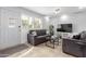 Comfortable living room with tile floors, shutters, and neutral decor at 7720 E Heatherbrae Ave # 13, Scottsdale, AZ 85251