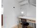 Cozy office nook featuring a modern desk, chair, and great lighting under the stairs at 7720 E Heatherbrae Ave # 13, Scottsdale, AZ 85251