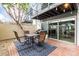 Beautiful outdoor patio area with dining set, grill, and convenient access to indoor spaces at 7720 E Heatherbrae Ave # 13, Scottsdale, AZ 85251