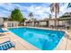 Beautiful community pool surrounded by lush greenery, providing a serene and relaxing atmosphere at 7720 E Heatherbrae Ave # 13, Scottsdale, AZ 85251