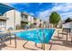 Inviting community pool area with comfortable lounge chairs and well-maintained landscaping at 7720 E Heatherbrae Ave # 13, Scottsdale, AZ 85251