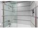 Stylish tiled shower-tub combination with glass door and built-in niche at 7720 E Heatherbrae Ave # 13, Scottsdale, AZ 85251